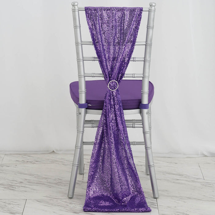 Purple sequin chair cover draped elegantly with a ring detail.