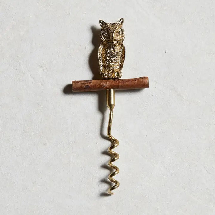 The BE HOME - OWL CORKSCREW by BE HOME, INC features a golden owl perched on a branch handle—an elegant accent for your home or a unique wine lover's gift.