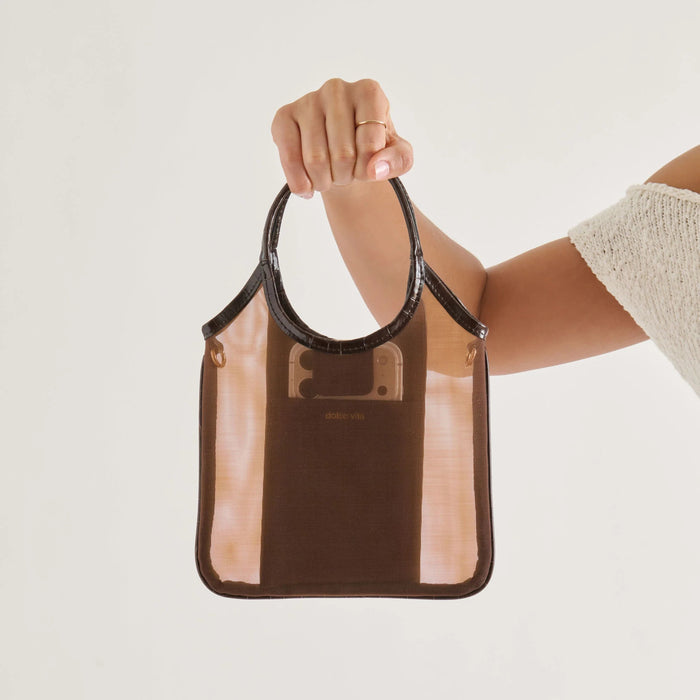 The DOLCE VITA - SYLVENE CROSSBODY MESH BAG IN CHOCOLATE features a chic square silhouette with brown stripes, rounded handles, and a gold chain strap, shown against a plain white background.