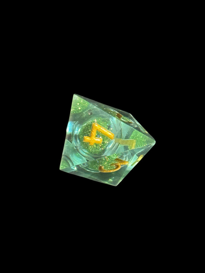 7-piece emerald green cosmos dice set with glitter swirl for D&D – Raven’s Cauldron, 6 N Sandusky St, Delaware, OH 43015