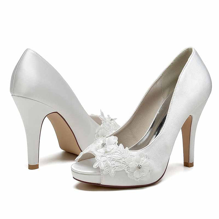 White flower lace bridal heels by S&DCo with elegant floral embellishments for weddings