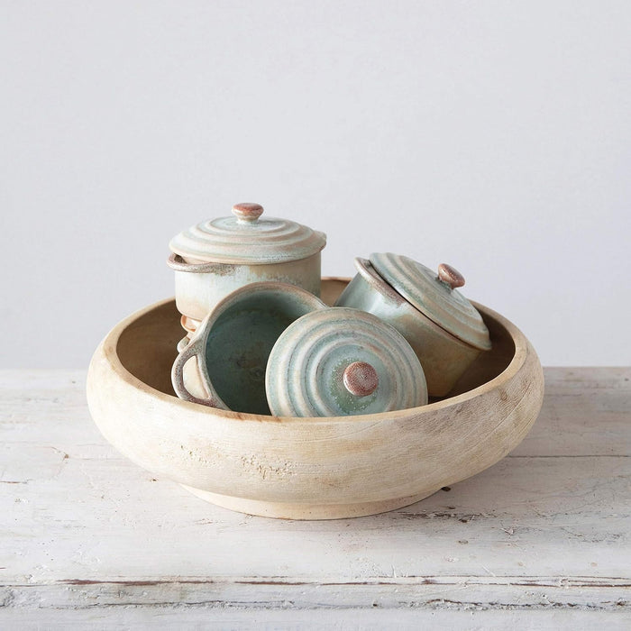Introducing the MINI STONEWARE BAKER WITH LID by CREATIVE COOP—a rustic, round ceramic pot with side handles and a matching lid. Crafted in striking blue-green and brown hues, this mini baker features a reactive crackle glaze for distinctive texture. The lid is topped with an easy-to-grip knob handle, making it ideal for serving individual casseroles in style.