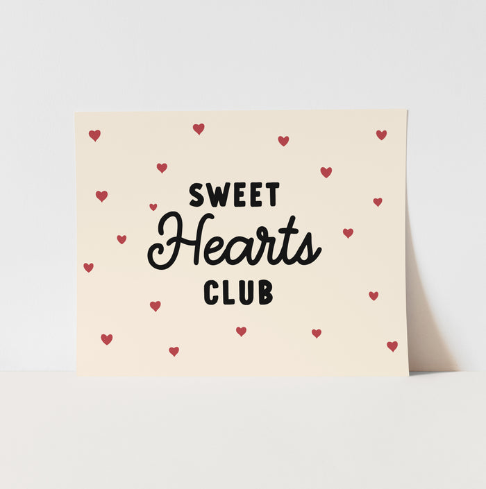 Card with 'Sweet Hearts Club' text and red hearts on a beige background