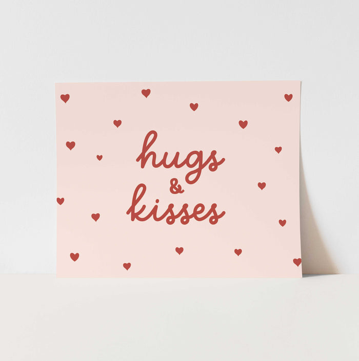 Card with 'hugs & kisses' text and heart patterns on a light pink background