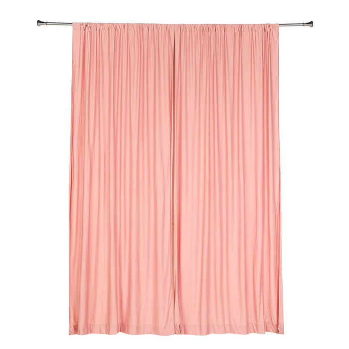 Pink pleated curtain set on a plain backdrop