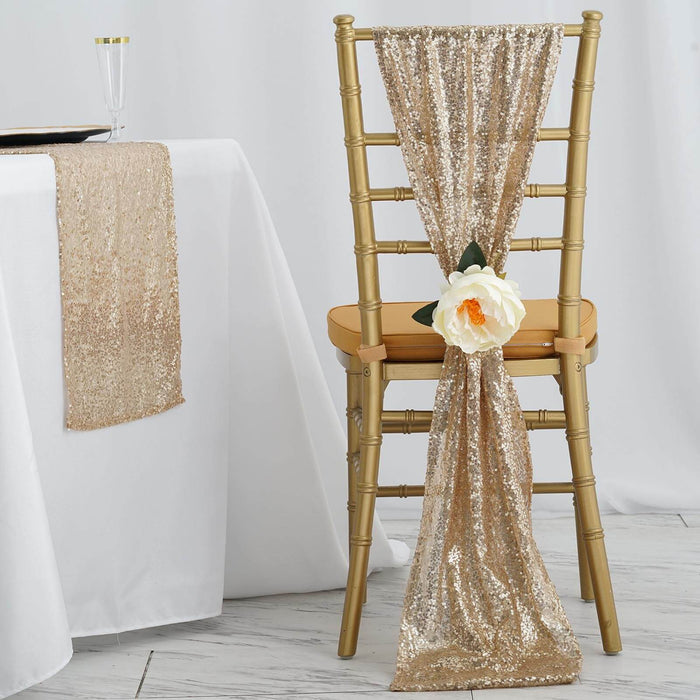 Gold sequin chair sash with flower decoration on a gold chiavari chair.