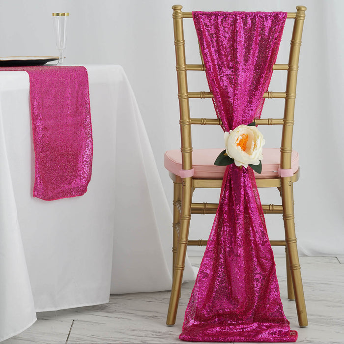 Pink sequin chair sash with flower decoration on a gold chair.