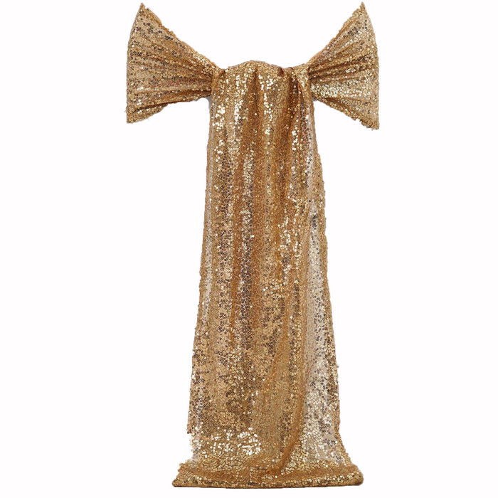 Gold sequin dress with bow detail on a plain backdrop #whtbkgd