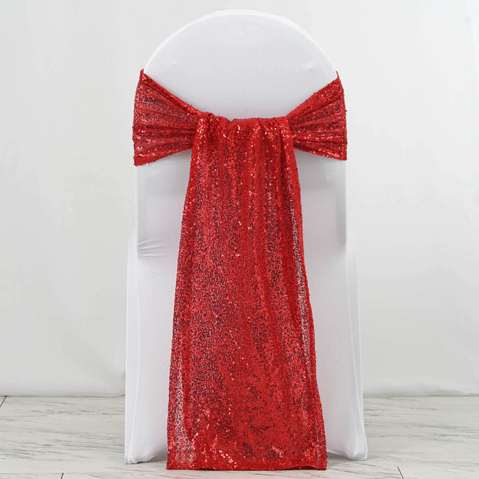 Red sequin chair sash draped elegantly over a white chair.