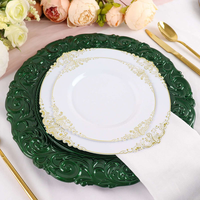 Elegant green and white dinner plate set with gold detailing on a decorative table setting.