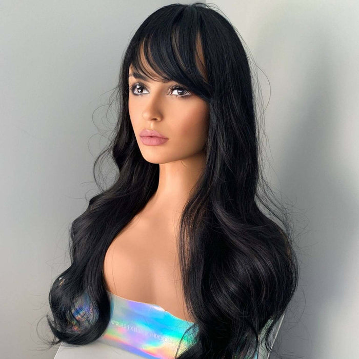 Mannequin head with long black wig on a plain background