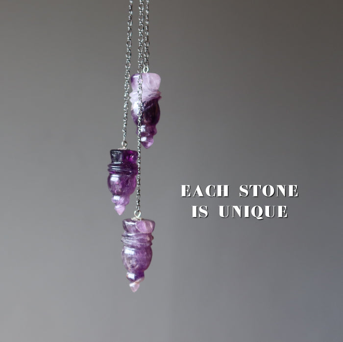 three amethyst pendulums
