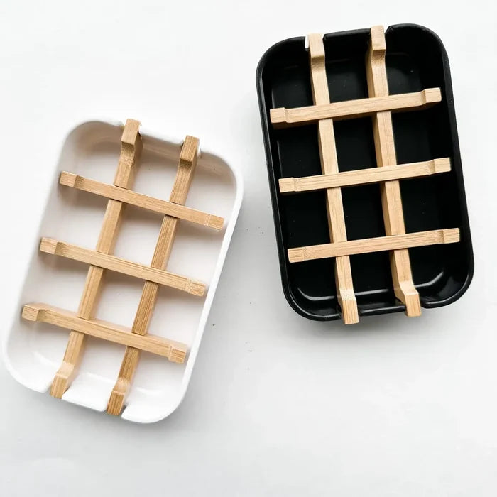 Two trays with woven wooden patterns on a white background