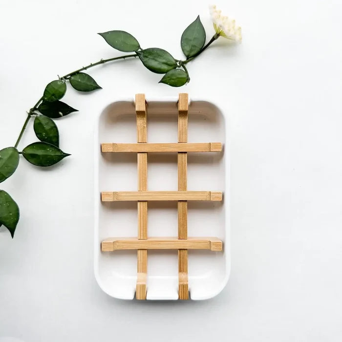 Rectangular white tray with woven bamboo design on a light background