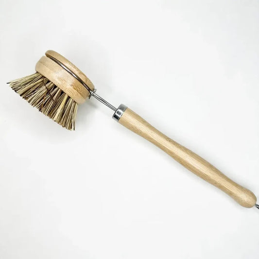 Wooden dish brush with bristle head on a white background