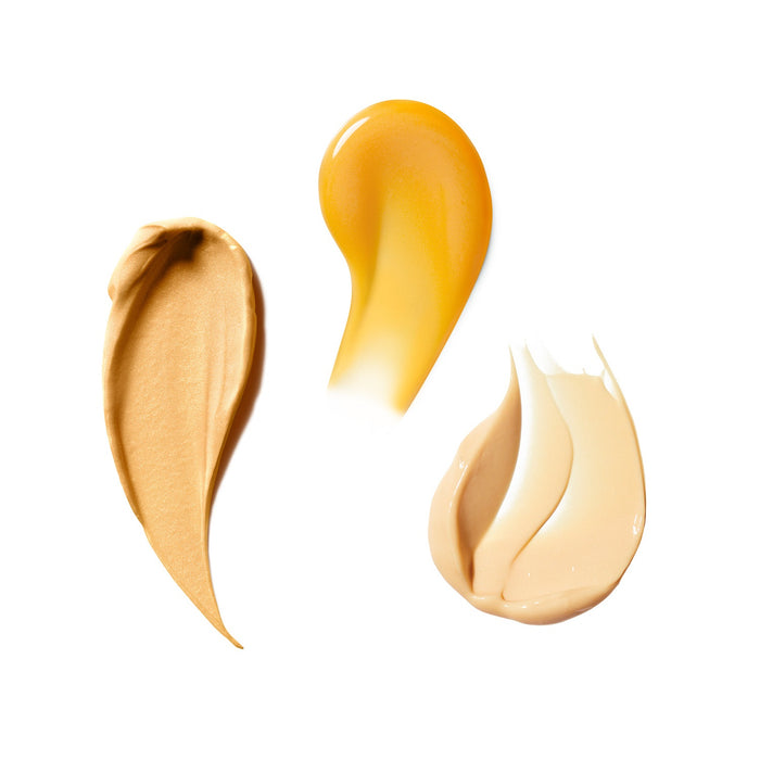 Smears of Banana Bright Vitamin C Serum, Banana Bright Face Primer, and Banana Bright+ Eye Crème shown on a white background.