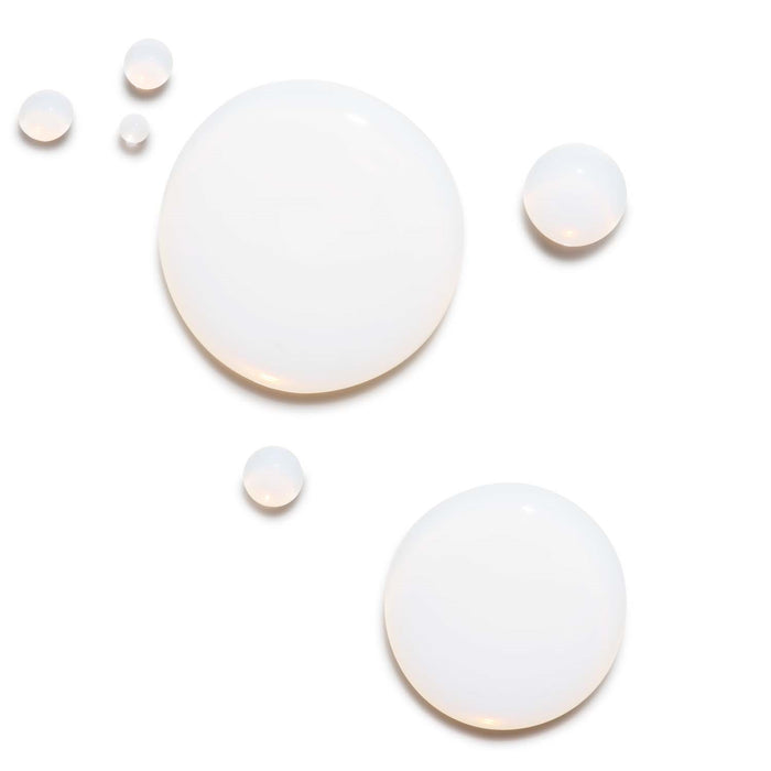 Liquid drops of Barrier Booster Orange Ferment Vitamin C Essence.