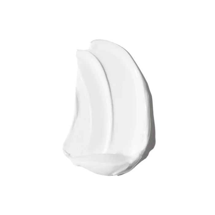 Smear of BeamCream Smoothing Body Moisturizer shown on a white background.