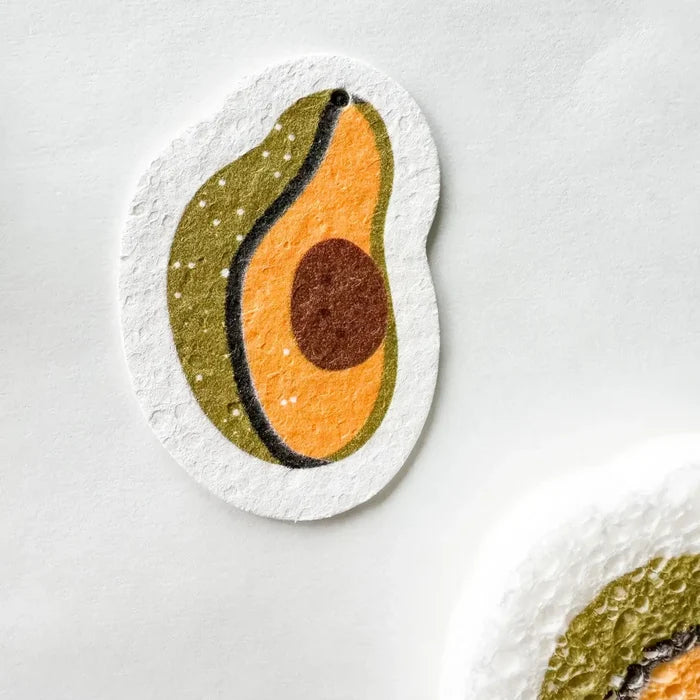 Avocado-shaped coasters on a white surface