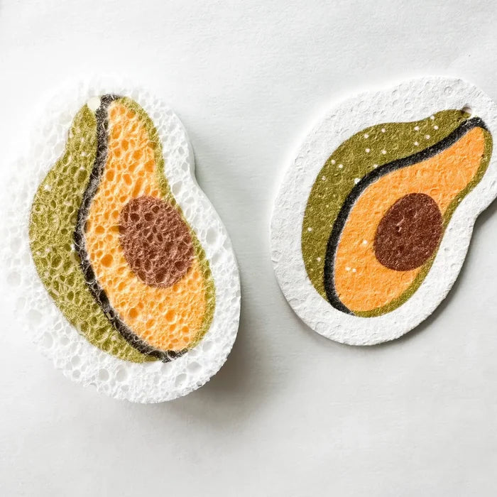 Two avocado-shaped sponges on a white background