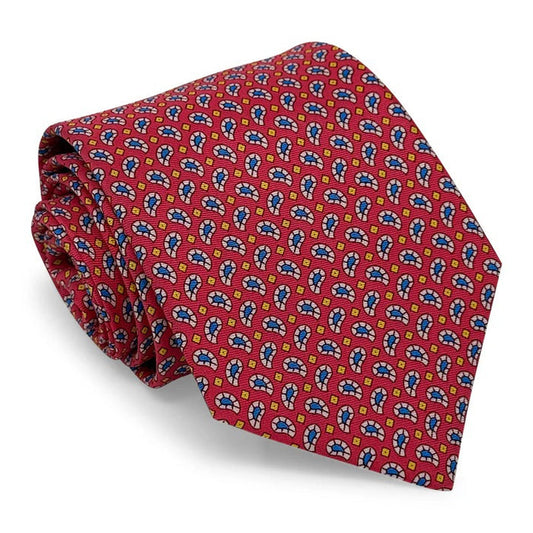 The BIRD DOG BAY Pablito Paisley Silk Tie in fuchsia is handmade in New York, featuring a colorful repeating pattern with blue, yellow, and white accents.