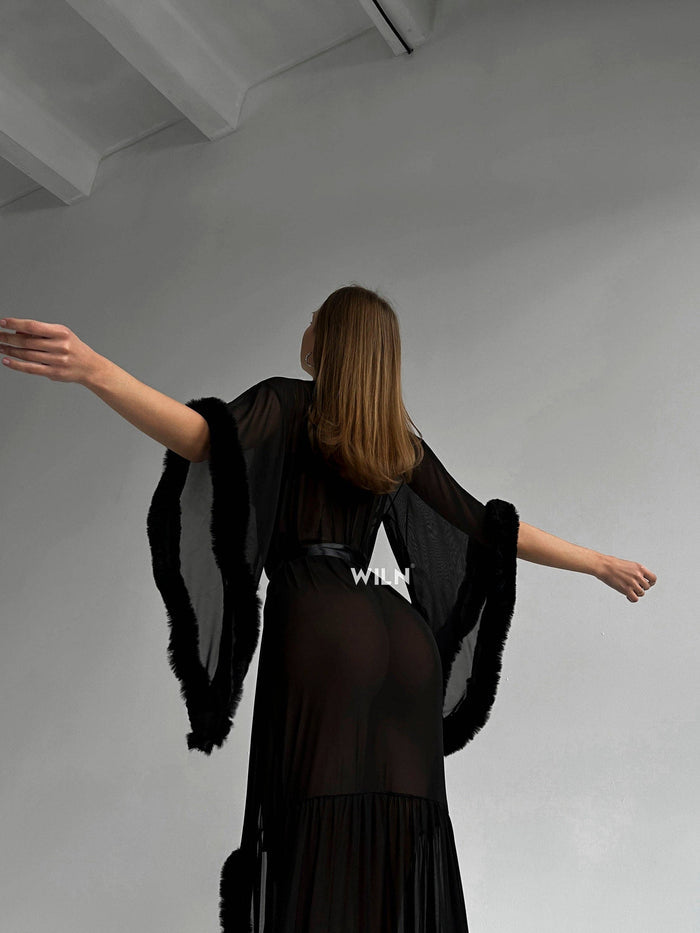 Model wearing a BURLESQUE Soft Mesh Dress, showcasing the elegant sheer fabric and dramatic silhouette.