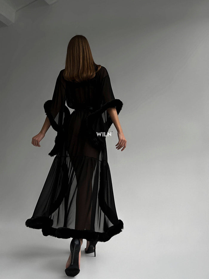 Model showcasing a BURLESQUE Soft Mesh Dress, highlighting the elegant silhouette and sheer mesh design.
