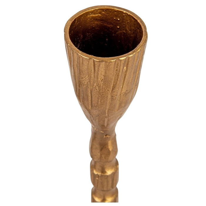 The CREATIVE COOP CAST IRON TAPER HOLDER IN BRASS FINISH, LARGE, features a tall, slender design with a textured segmented stem and round base, perfect for displaying a single taper candle.