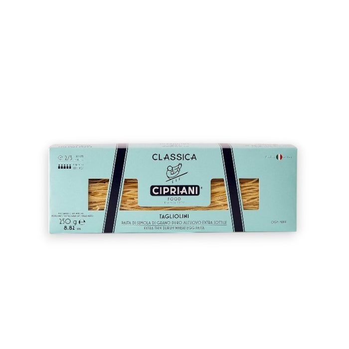 A rectangular light blue box labeled "Atalanta Corporation" containing Cipriani - Organic Tagliolini Egg Pasta made from premium durum wheat semolina is centered on a white background. The packaging features the brand name, weight (250g/8.82 oz), a small Italian flag, and the pasta is visible through a window in the packaging.