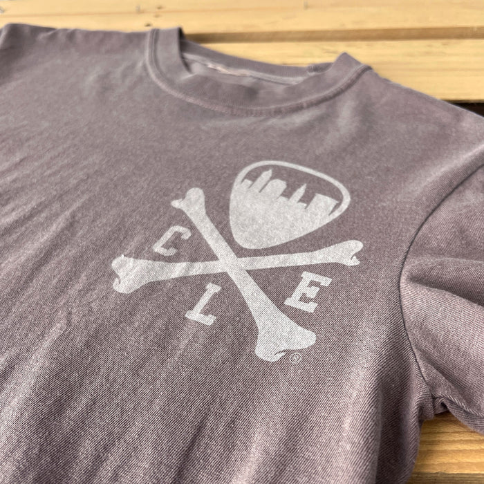 Gray t-shirt with white graphic design on a wooden surface