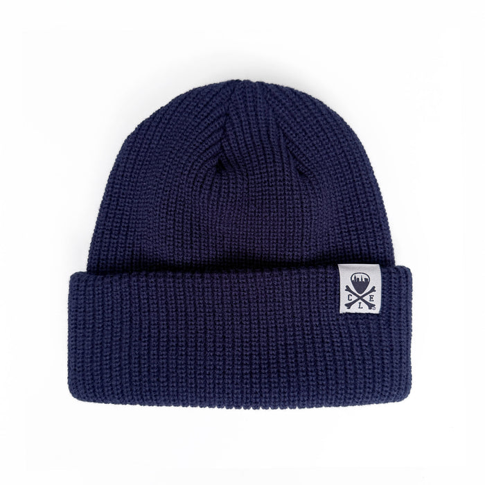 Navy blue beanie with a white logo on a white background