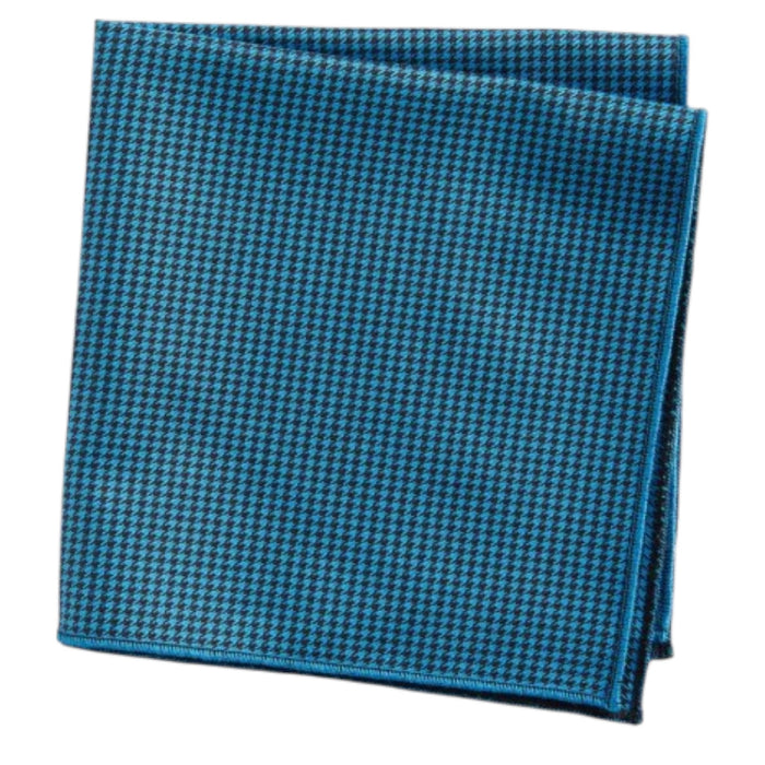 The CLIFTON WILSON Teal Houndstooth Cotton Pocket Square, made in the USA, is neatly folded and displayed on a white background.
