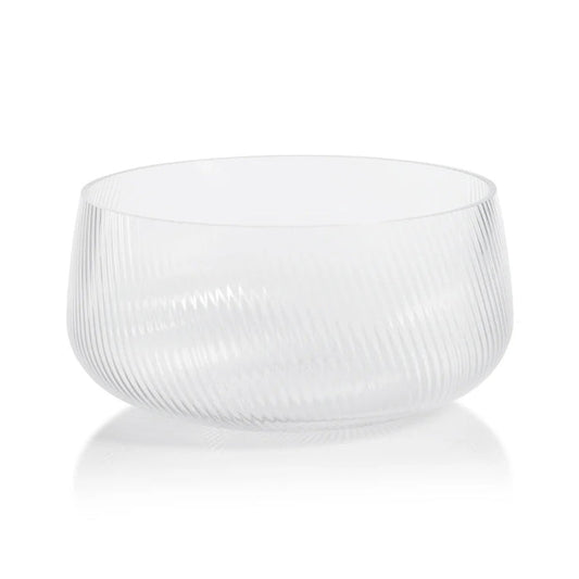 The ZODAX CONNAUGHT RIPPLED GLASS BOWL - LARGE is a clear, round glass bowl with a subtle diagonal ribbed pattern, measuring 10.75 in x 5 in, shown on a white background.