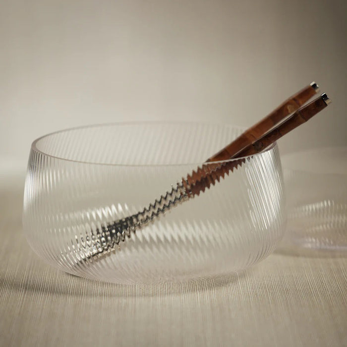 The ZODAX CONNAUGHT RIPPLED GLASS BOWL - LARGE is a clear, round glass bowl with a subtle diagonal ribbed pattern, measuring 10.75 in x 5 in, shown on a white background.