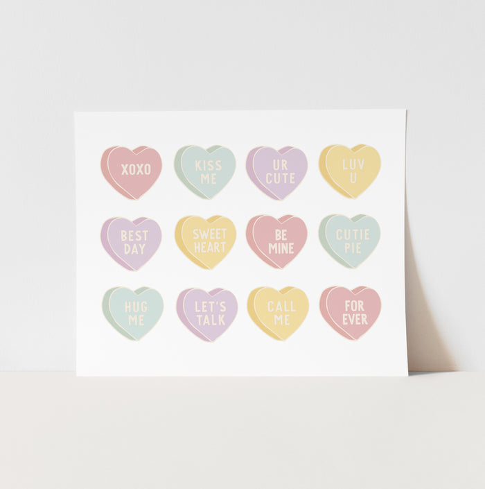 Card with pastel-colored heart-shaped stickers with various messages on a white background
