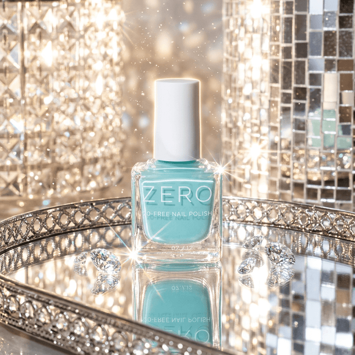 Turquoise nail polish bottle on a decorative tray with a sparkling background