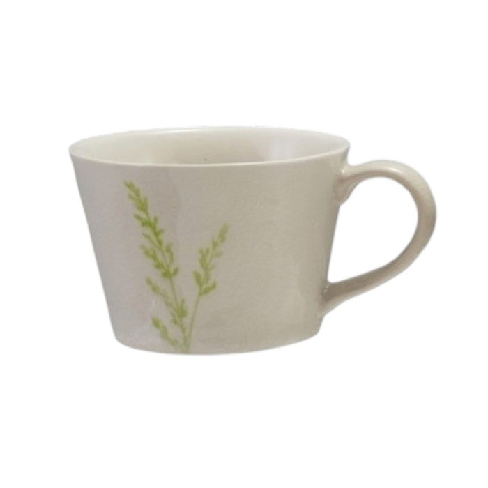 Four DEBOSSED STONEWARE MUGS WITH BOTANICAL PATTERN by CREATIVE COOP, featuring cream color, unique green botanical designs, and a subtle reactive glaze finish, are lined up side by side on a white background.