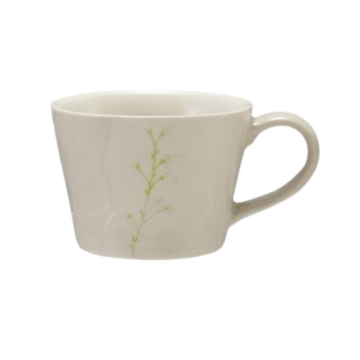 Four DEBOSSED STONEWARE MUGS WITH BOTANICAL PATTERN by CREATIVE COOP, featuring cream color, unique green botanical designs, and a subtle reactive glaze finish, are lined up side by side on a white background.