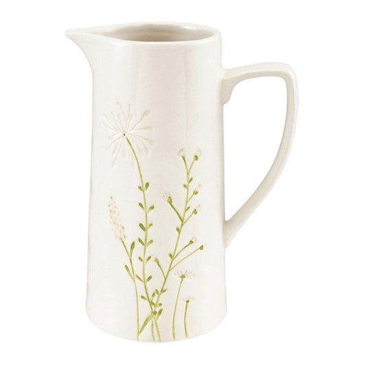 The CREATIVE COOP DEBOSSED STONEWARE PITCHER WITH BOTANICAL PATTERN, paired with three cups and two plates featuring delicate hand-painted green and beige florals, is arranged against a textured off-white background.