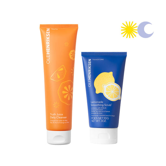 A closed Lemonade Soothing Scrub next to a closed Truth Juice Daily Cleanser. Upper right corner has an icon of a yellow sun and blue moon.