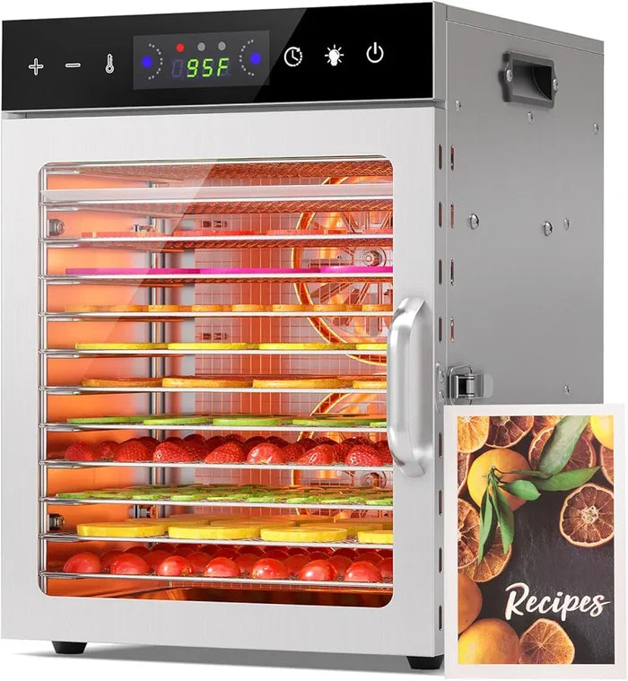 Digital food dehydrator with open door showing trays of food and a recipe book on a white background.