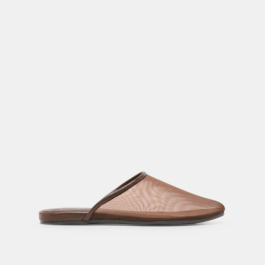 The DOLCE VITA - GENI Mesh Flats in Chocolate are chic brown slip-on mules with a low heel and flat sole, inspired by ballet flats, shown against a light gray background.