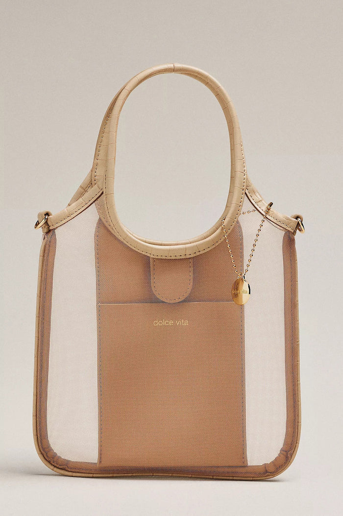 The DOLCE VITA Sylvene Crossbody Mesh Bag in Blush features a chic square shape, beige faux leather handles and trim, transparent mesh sides, a tan inner pocket with "dolce vita" in gold, plus a gold chain and small charm.
