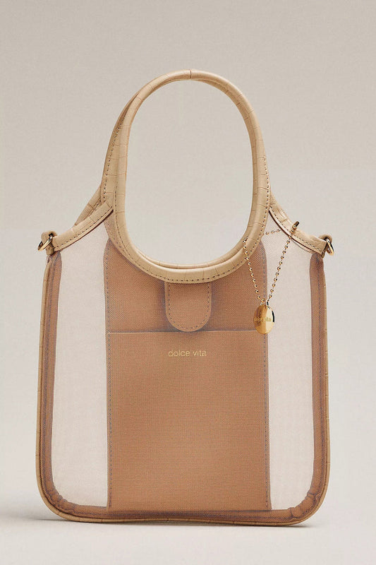 The DOLCE VITA Sylvene Crossbody Mesh Bag in Blush features a chic square shape, beige faux leather handles and trim, transparent mesh sides, a tan inner pocket with "dolce vita" in gold, plus a gold chain and small charm.