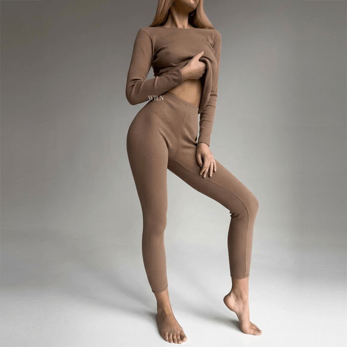 EASE 2 Piece Ribbed Cotton Loungewear Set - Biscuit modeled by a woman, showcasing its soft and flattering fit.