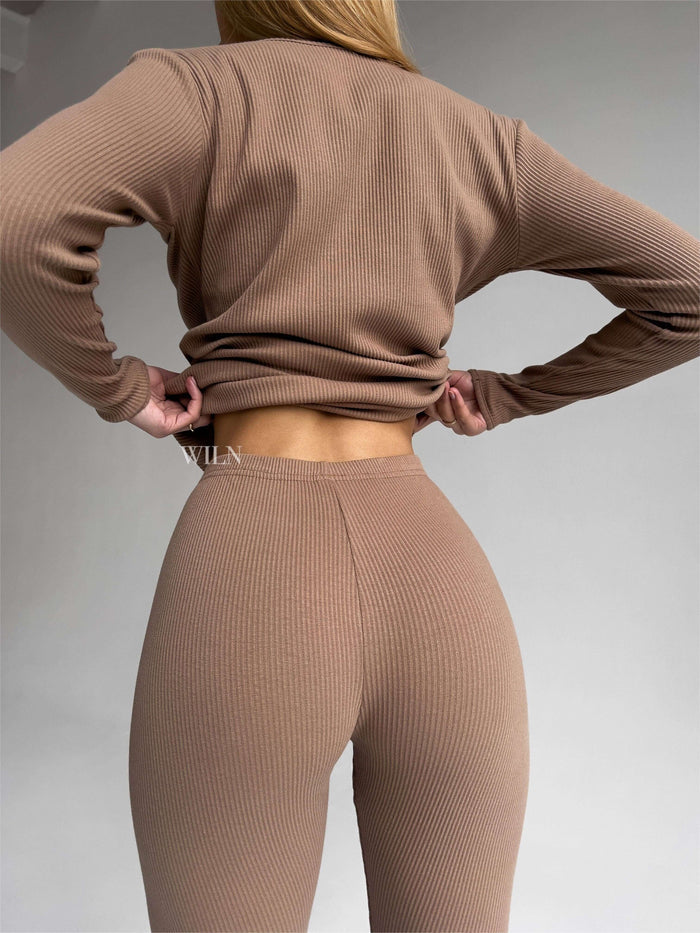 EASE 2 Piece Ribbed Cotton Loungewear Set - Biscuit shown from behind, highlighting the soft ribbed fabric and fitted design.