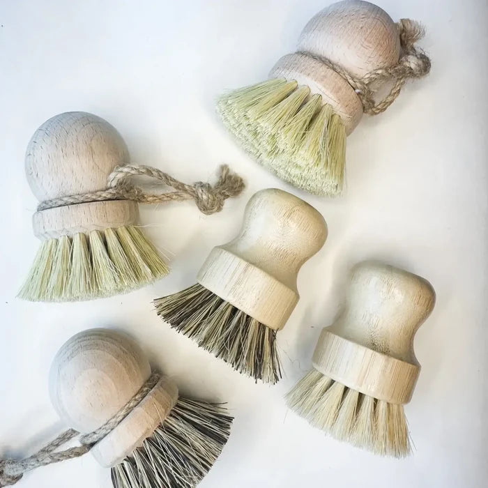 Set of wooden brushes with bristle heads on a white background