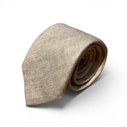 The EDWARD ARMAH Solid Khaki Silk Tie, featuring a textured finish, is shown neatly rolled on a plain white background.