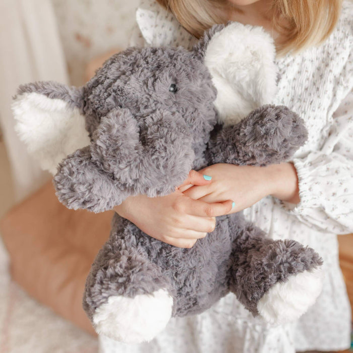 Eleanor The Weighted Elephant plush toy being hugged by a child, designed for comfort and calm.