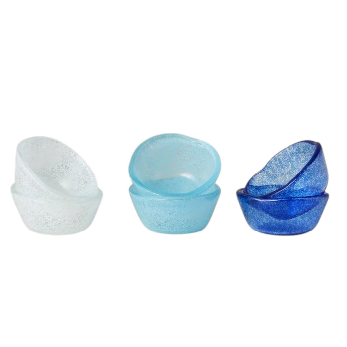 Six handcrafted ETUHOME Glass Pinch Pots in white, light blue, and dark blue are stacked on a white marble surface.